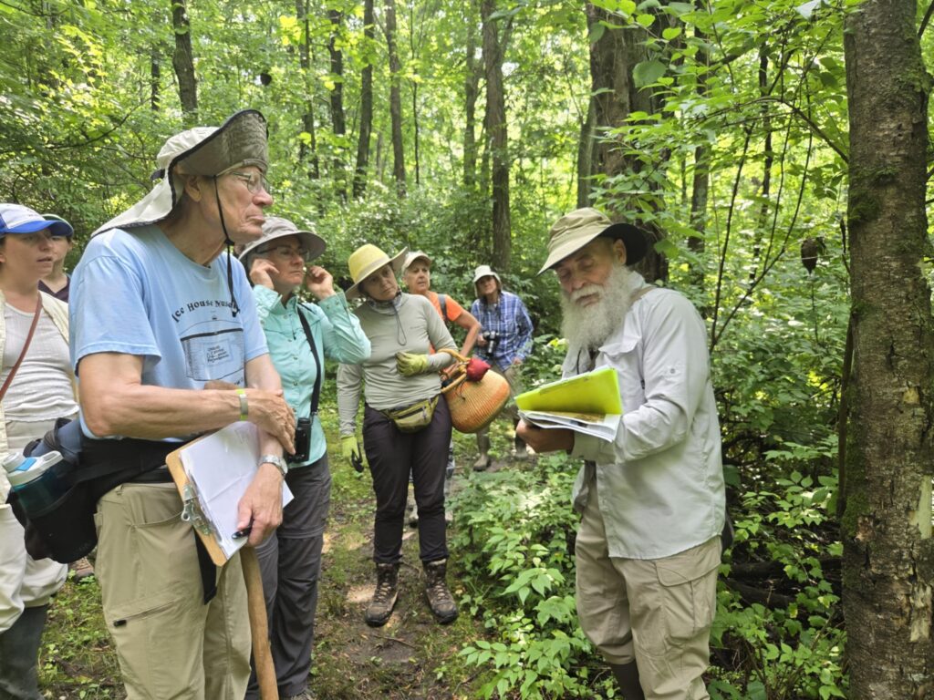 Attendees in wooded paha habitat